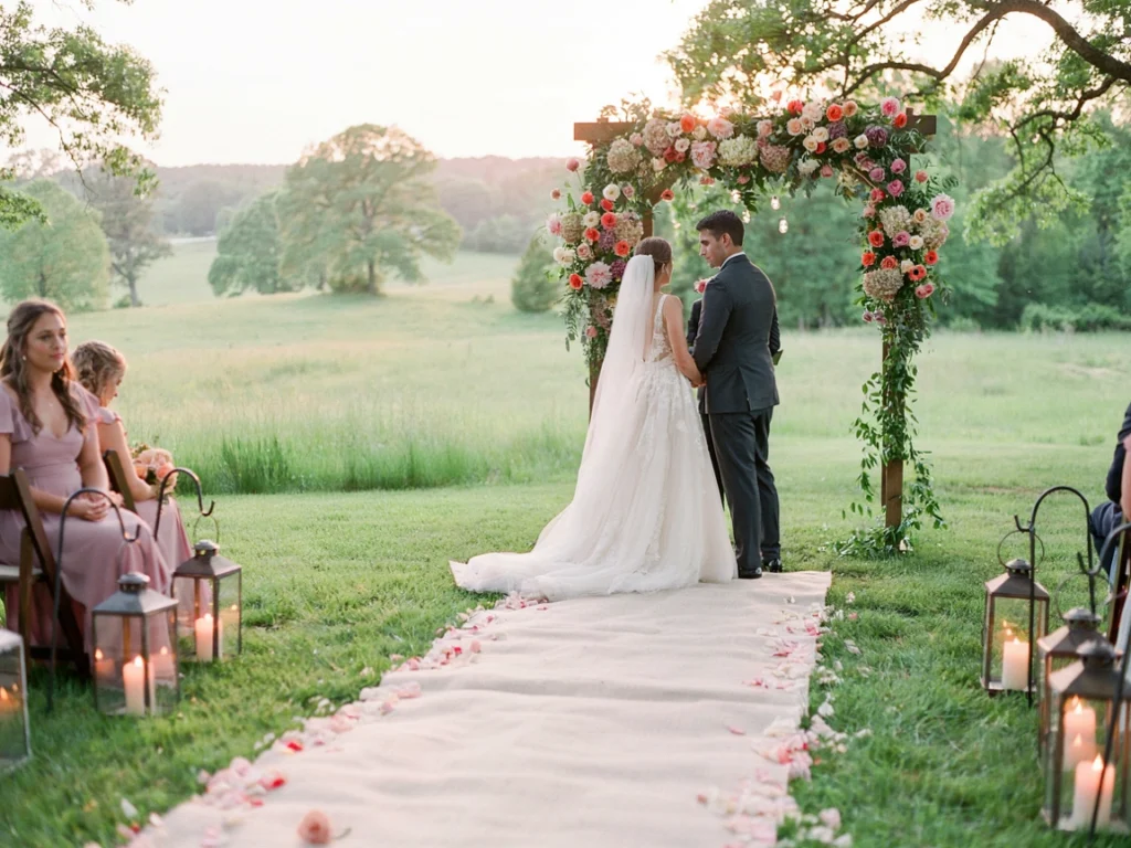 Colorful wedding ceremony arch and aisle decor setup